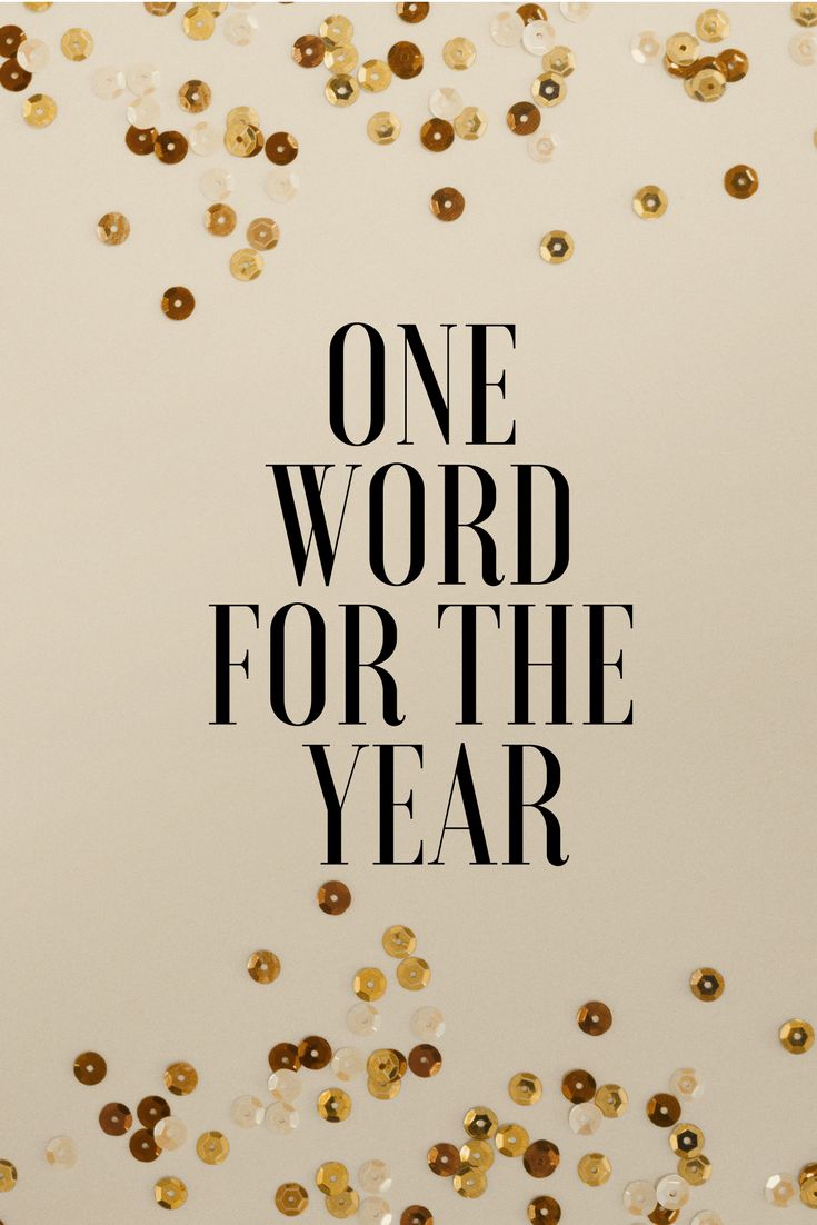 the words one word for the year are surrounded by gold and white confetti