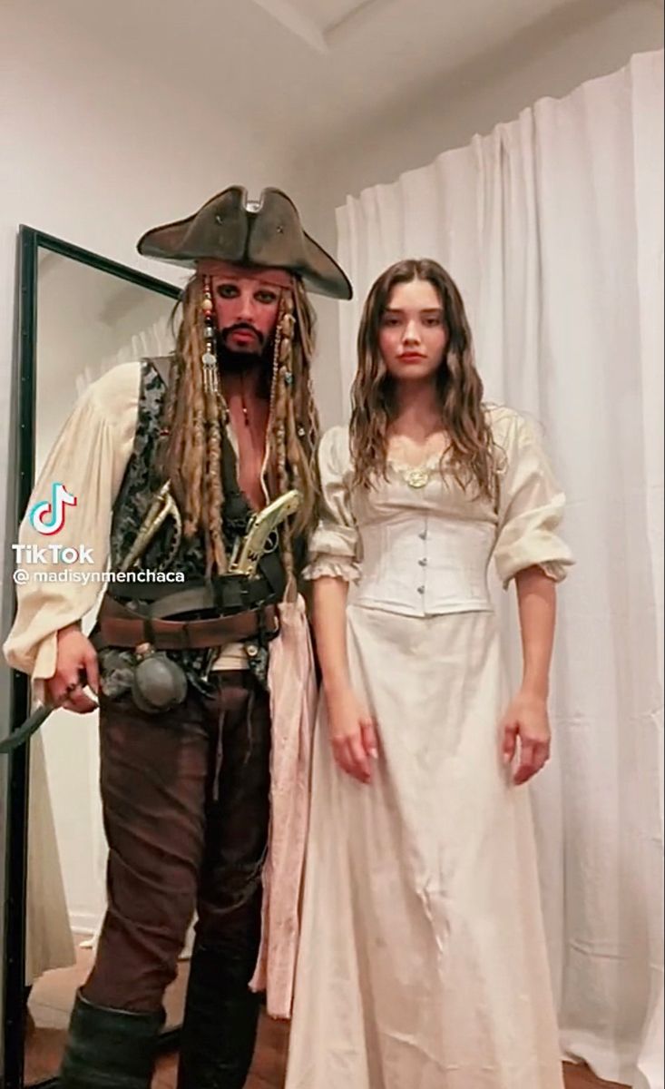 a man and woman dressed up as pirates