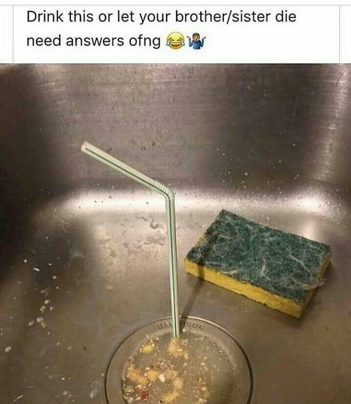 a dirty sink with a sponge and a straw sticking out of it