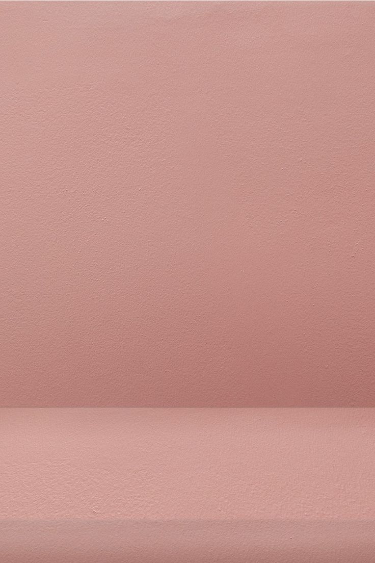 an empty pink shelf against a pale pink wall