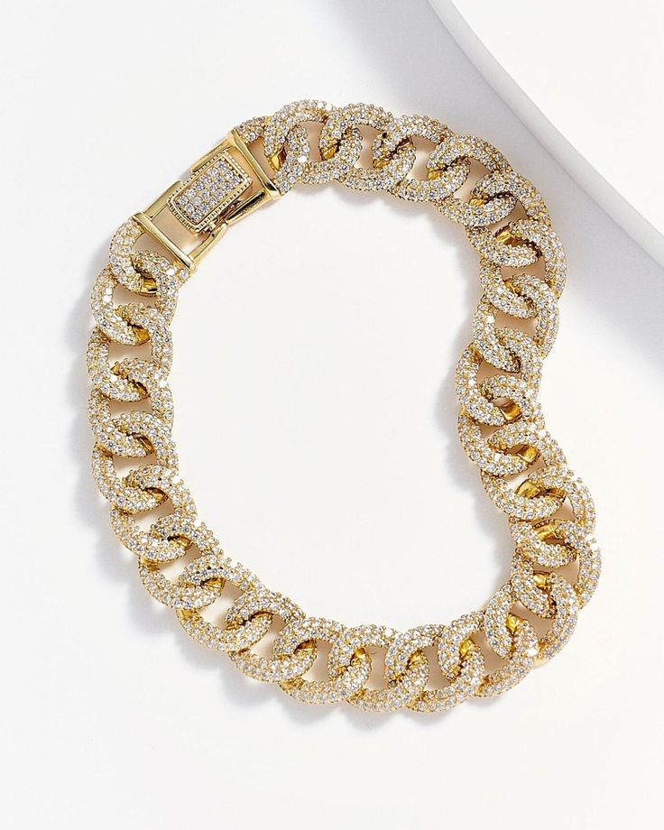 Purely divine, the Lorena Curb Chain Link Bracelet is a stunning accessory fit for royalty. Sheerly elegant, the elongated curb link design made from 14k gold plating over genuine sterling silver is completely encrusted in countless clear diamonettes, lending an utterly dazzling effect. An ideal selection for adding more distinction to your evening attire, this fancy piece is a must for any woman who needs to stand out in style. Fine dining, theater, opera, weddings, galas and more, it is a lege Luxury Elegant Sterling Silver Curb Chain Bracelet, Luxury Rectangular Cable Chain Bracelets, Luxury Gold-tone Link Jewelry, Luxury Rectangular Curb Chain Jewelry, Link Design, Affordable Jewelry, Metal Earrings, Curb Chain, Chain Link Bracelet