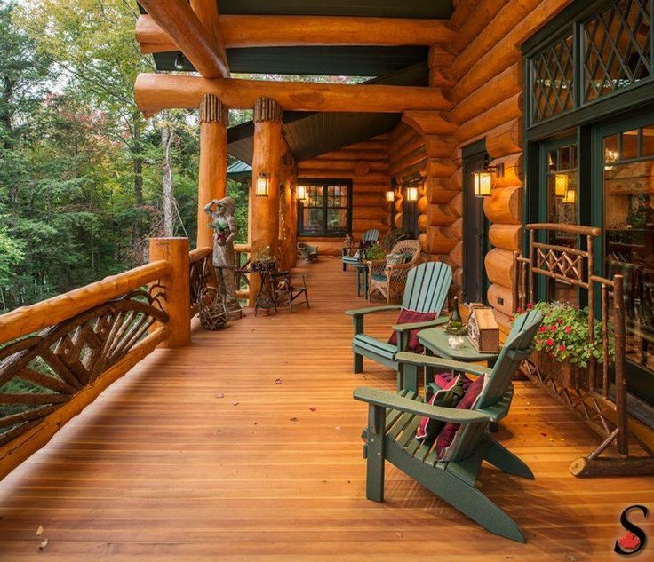 a wooden porch with chairs and tables on it