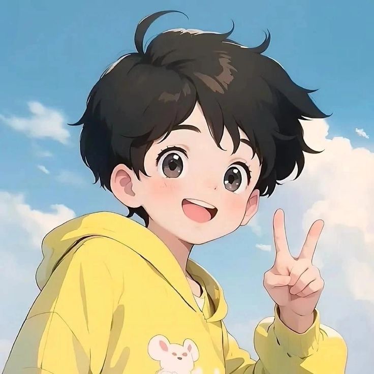 a young boy in a yellow hoodie pointing at the camera with his finger up