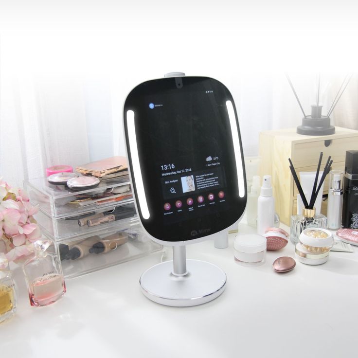 a white table topped with lots of beauty products and cosmetics bottles on top of it