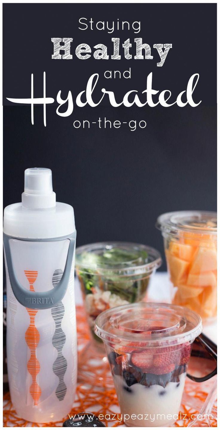 an image of healthy and hydrated on the go food in containers with text overlay that reads staying healthy and hydrated on the go