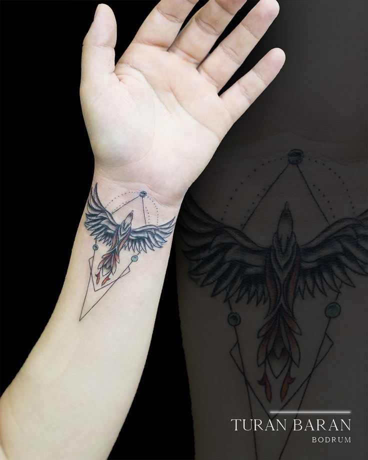 a woman's arm with a bird and triangle tattoo on the left side of her arm