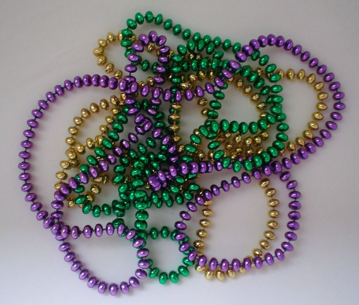 several beads are arranged together on a white surface