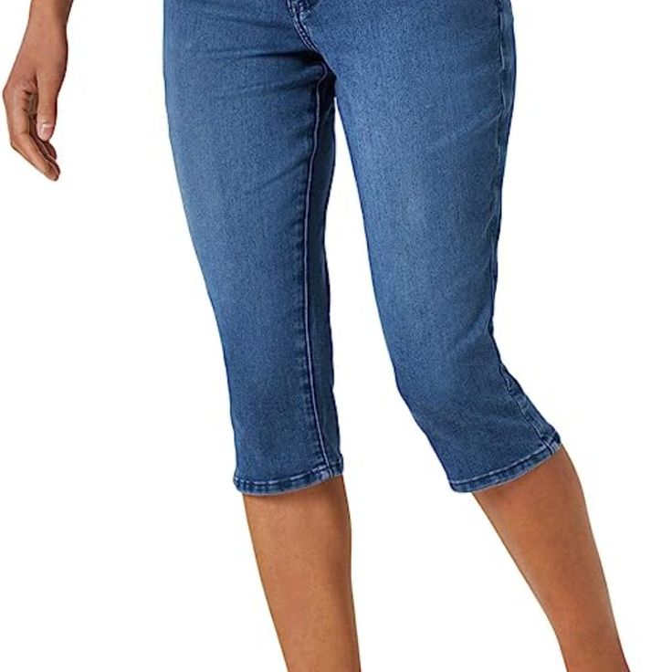 Riders By Lee Indigo Women's Midrise Capri Jeans In Lee's "Ultra Soft Stretch Denim". The Color Is "Sedona", A Dark Indigo. Size 8 Medium, Cropped, Regular Fit. Can Be Worn Cuffed Or Straight. Zipper Fly With Button Closure. 5 Pocket Style, Back Pockets Feature Embroidery. New Without Tags, Never Worn. From Non-Smoking Home. Fabric: 73% Cotton, 25% Polyester, 2% Spandex Measurements: Waist 30", Inseam 18", Overall Length Including Waistband 27", Front Rise 10". Stretch Knee-length Cropped Denim Jeans, Stretch Medium Wash Cropped Leg Capris, Stretch Medium Wash Cropped Capris, Stretch Medium Wash Capris With Cropped Leg, Stretch Denim Blue Capri Jeans, Stretch Medium Wash Capri Length Capris, Medium Wash Knee-length Denim Capris, Denim Knee-length Capris With Pockets, Stretch Denim Knee-length Jeans