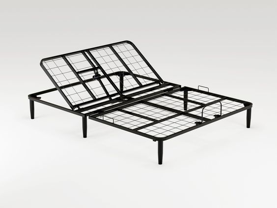 a metal bed frame sitting on top of a white floor