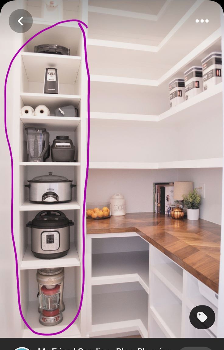 a kitchen with white shelves and purple lines on the bottom half of the shelf above it