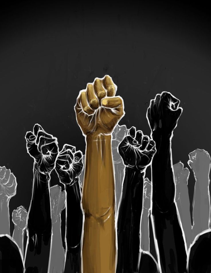 a group of people raising their fists in the air