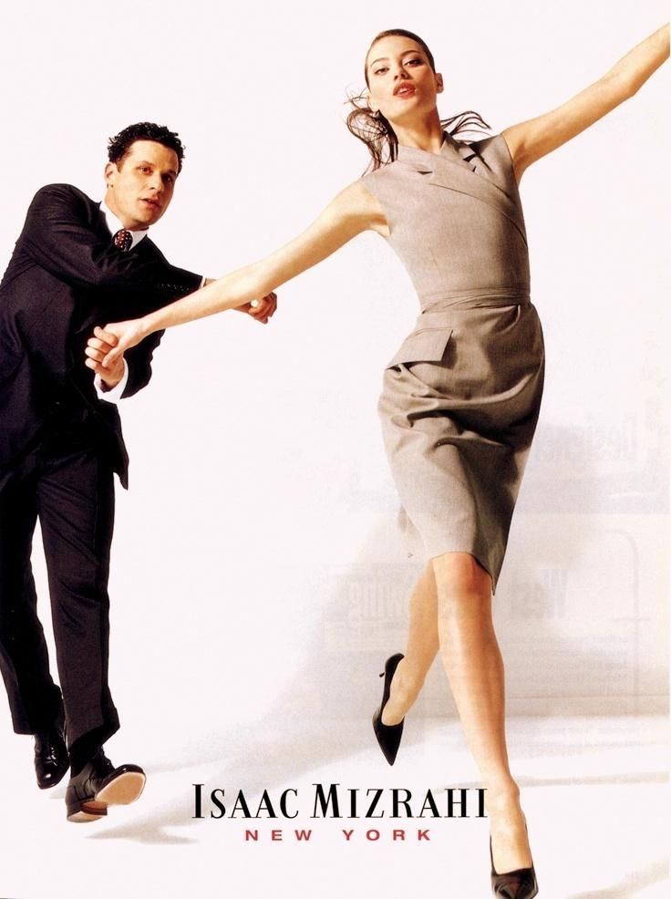 a man and woman are dancing together in front of a white background with the caption, isaac mizrah new york