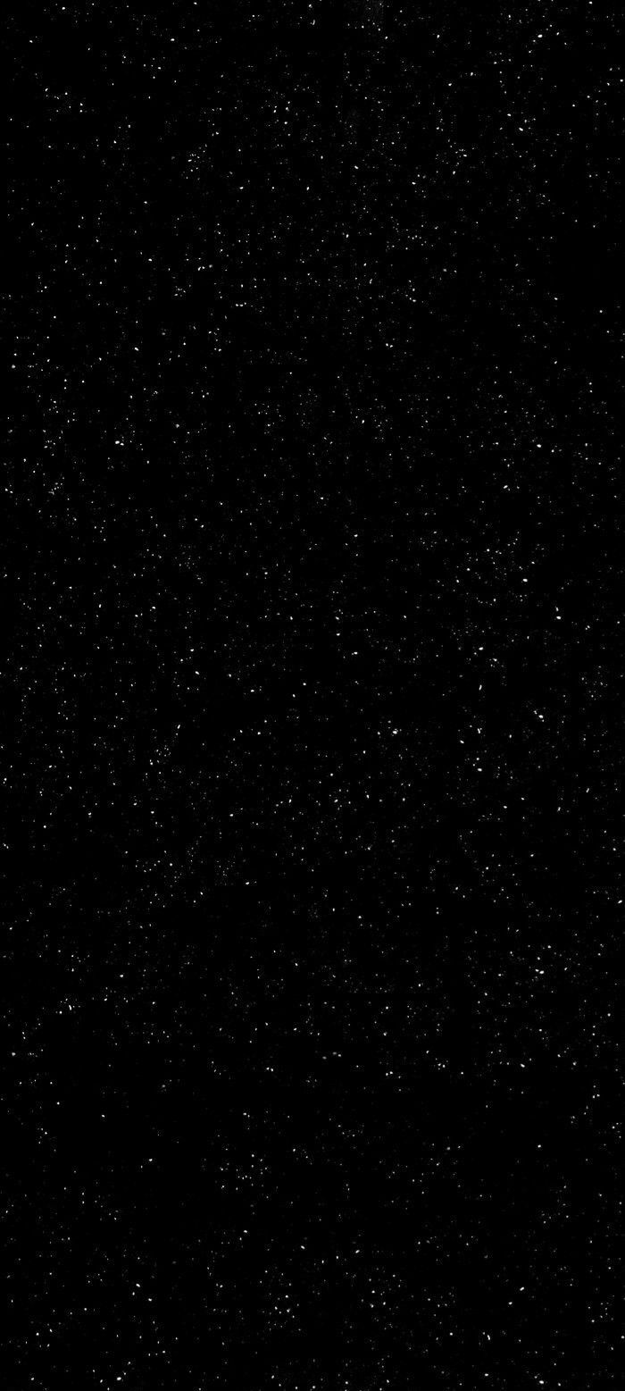 an airplane flying through the night sky with lots of stars on it's side