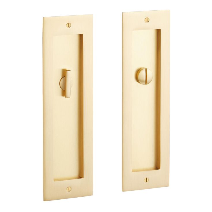 two door handles are shown on the front and back of an ivory colored cabinet doors