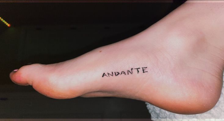 a foot with the word andante written on it's side, in black ink