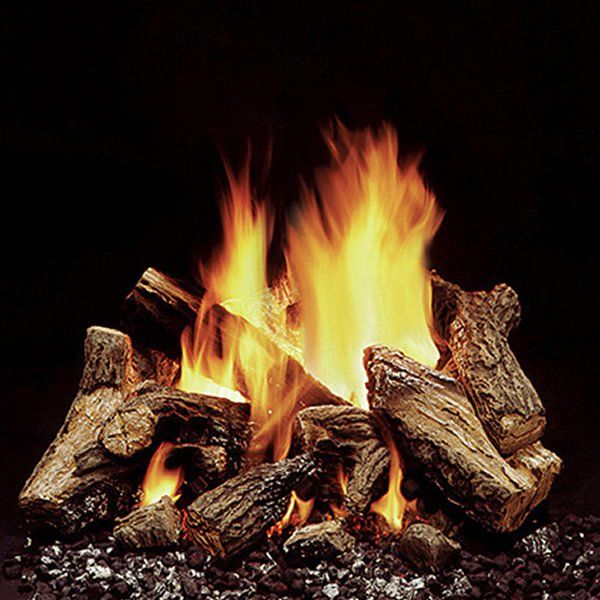 a fire burning in the fireplace with rocks and gravel around it's edges, on a black background