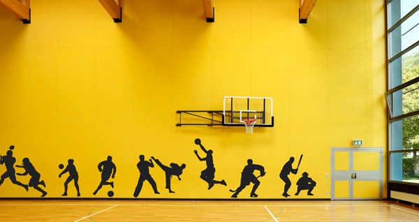 a basketball court with several silhouettes of people on it