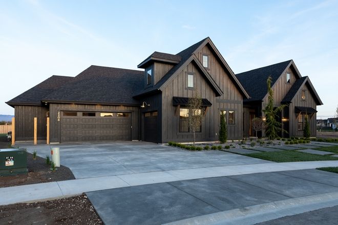 a large house with two garages on each side