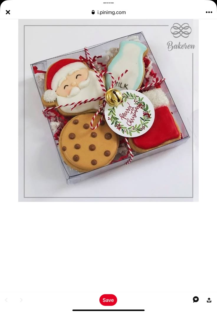 an image of cookies in a box with santa clause on top and other christmas treats