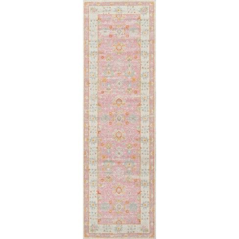 a pink and yellow rug with an ornate design on the bottom, in front of a white background