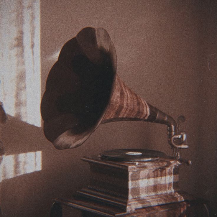 an old record player with a megaphone on top of it