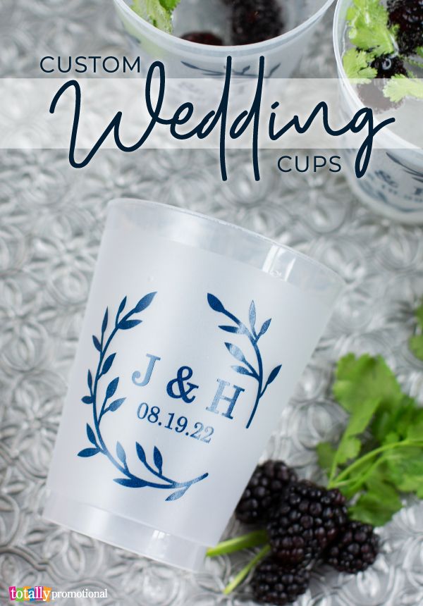 the wedding cups are decorated with berries and leaves