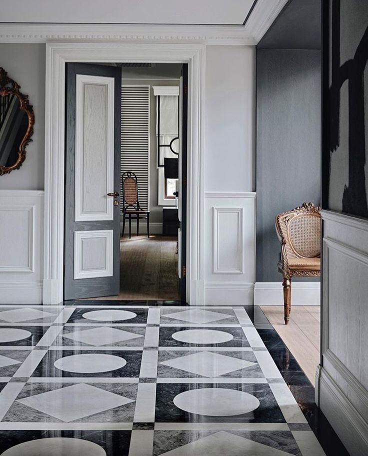 an elegant entry way with black and white flooring