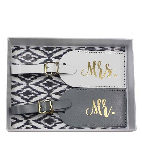 two personalized luggage tags in a gray and white gift box with gold foil lettering