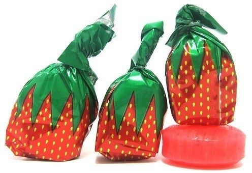 two plastic strawberries sitting next to each other