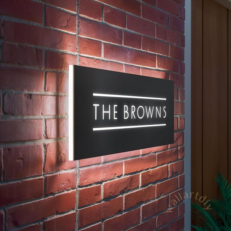 the brown's restaurant sign on a brick wall next to a potted plant