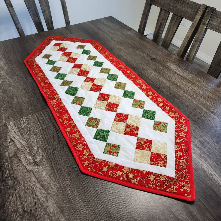 a table runner on top of a wooden floor next to a dining room table with chairs