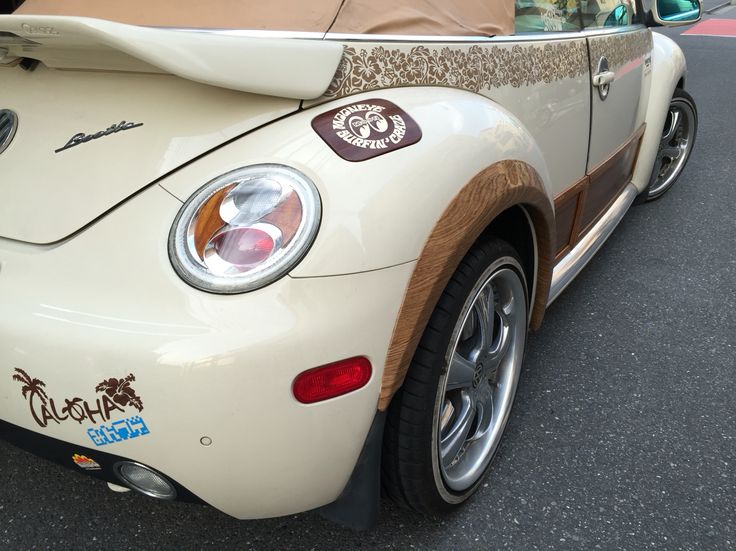 the back end of a white sports car