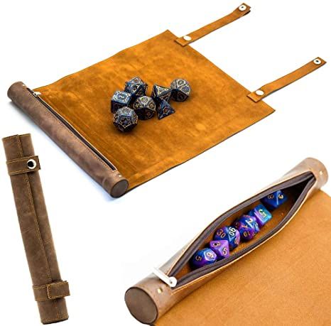 a bag with dice in it sitting on top of a table next to other items