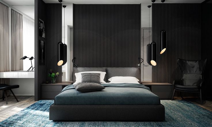 a bedroom with black walls and blue rugs on the floor, along with a large bed