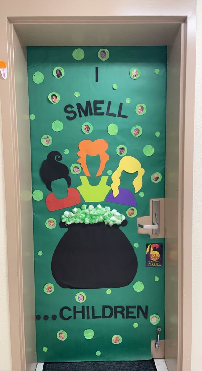 a door decorated with the words i smell children and an image of a pot full of flowers