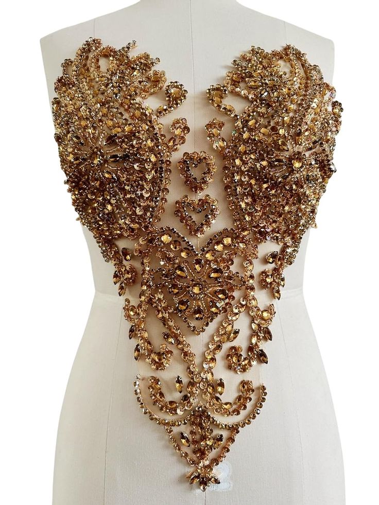 a mannequin with an elaborate necklace on it's chest and neck piece