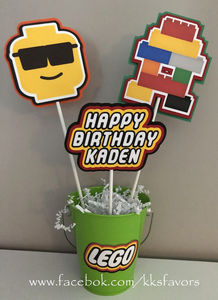 lego birthday cake toppers in a bucket