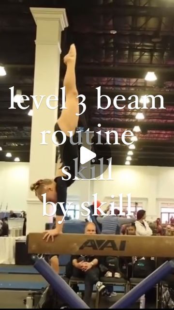 a person doing a handstand on a beam in an indoor area with people watching