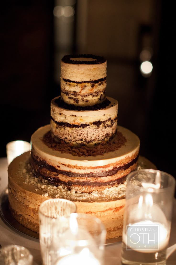 a three tiered cake sitting on top of a table