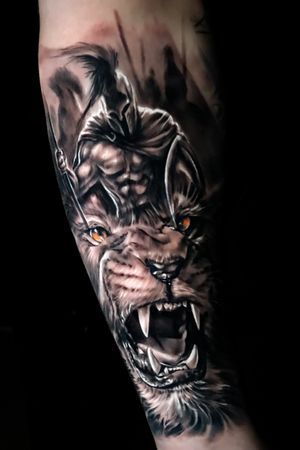 a man's arm with an image of a wolf on it and his face