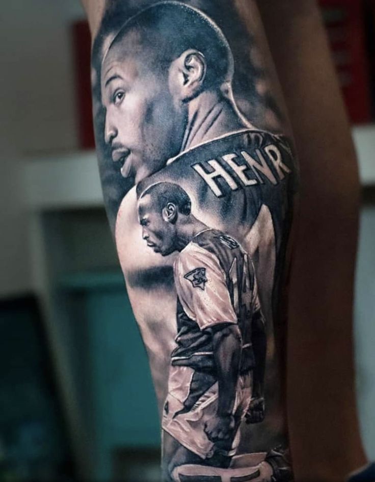 the back of a man's leg with an image of two men on it