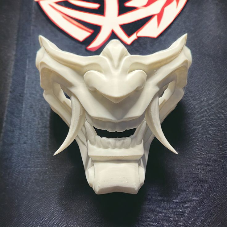 Majin Mempo Mask - 3D Printed Décor, Costume, Cosplay Immerse yourself in the world of Japanese folklore with our Majin Mempo Mask. Inspired by traditional Noh and Samurai designs, this mask embodies the essence of mystical beings. Majin masks are often associated with supernatural powers and have a rich history in Japanese culture. Now, you have the opportunity to bring this captivating tradition to life through your own artistic expression. Whether you're a cosplayer, collector, or simply pass Mempo Mask, Japanese Noh Mask, Mystical Beings, Supernatural Powers, Noh Mask, Kitsune Mask, Japanese Folklore, Half Mask, Biodegradable Plastic