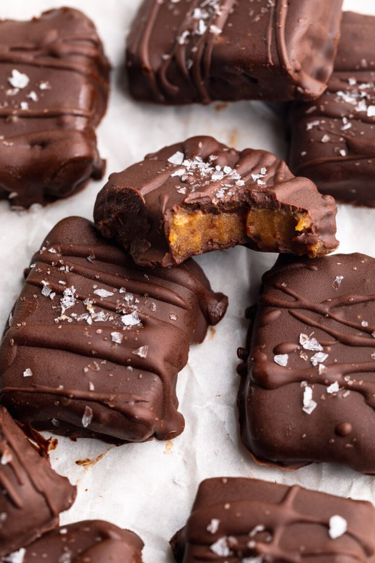 chocolate covered pieces of cake with white sprinkles