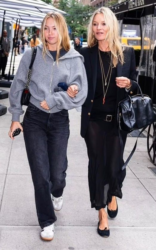 two women walking down the street together