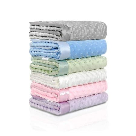 six folded towels stacked on top of each other