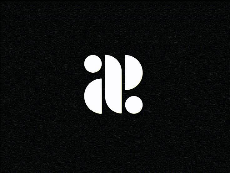 the letter j is made up of two white dots on a black background with an oval shape