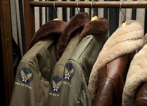 two pictures of jackets hanging on a rack and another photo of the same jacket with fur collars