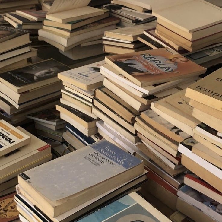 a pile of books sitting next to each other