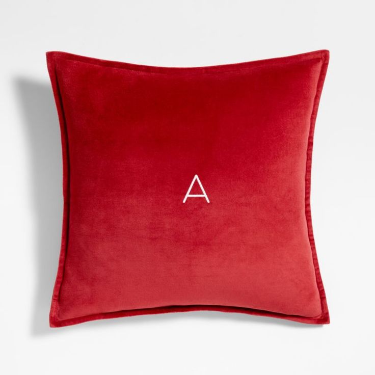 a red pillow with the letter a on it