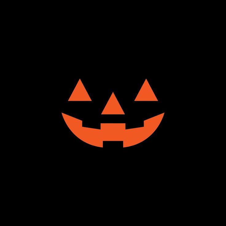 a black background with an orange pumpkin face